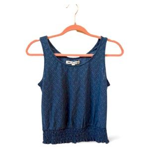 Blue tank top with eyelets and ruching around the bottom.